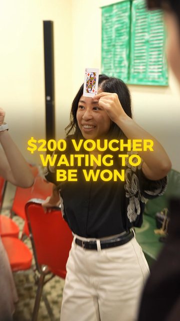 Video frame: a woman playing a card game, a $200 voucher waiting to be won